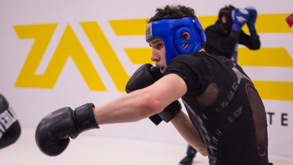 A man is boxing in a boxing ring.